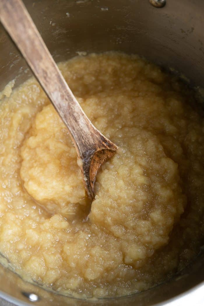 Image of cooked and mashed apples in a large pot.