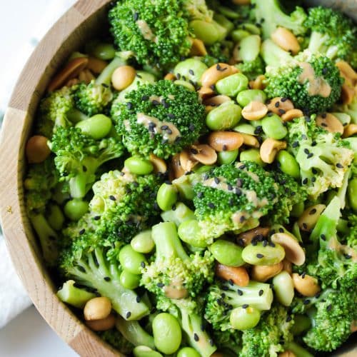 A bowl of food with broccoli, with Peanut and Salad