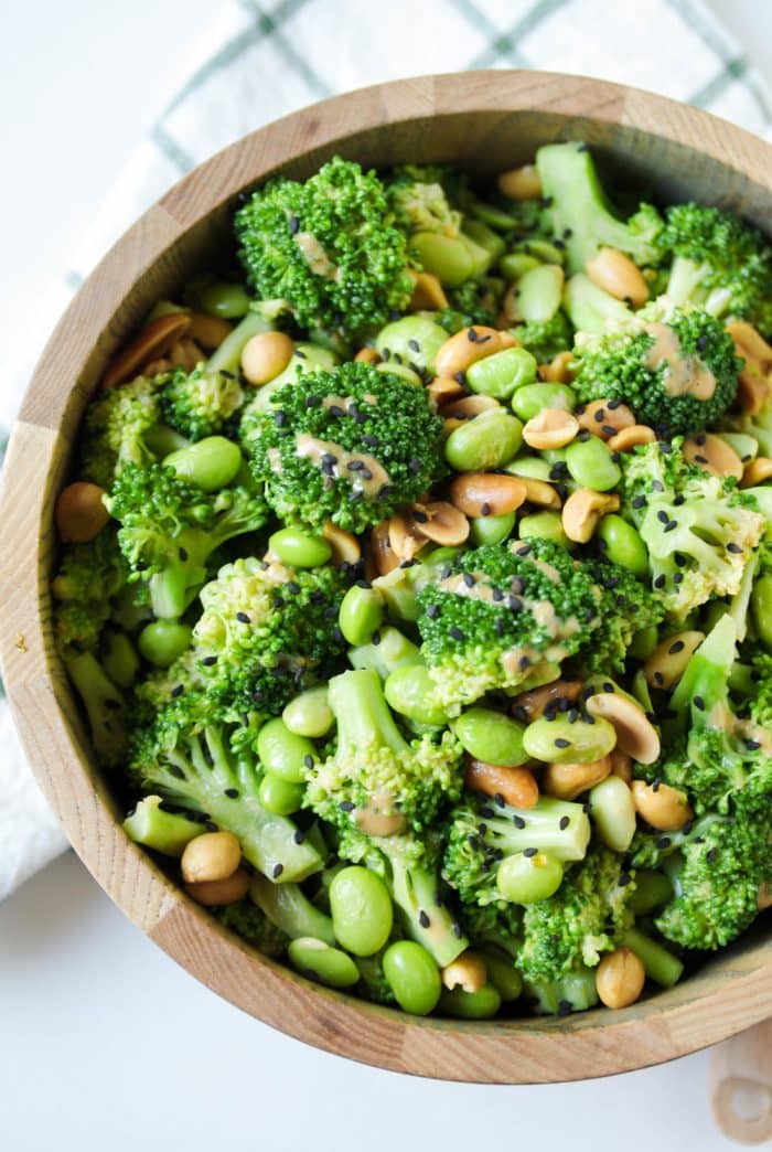 A bowl of food with broccoli, with Peanut and Salad