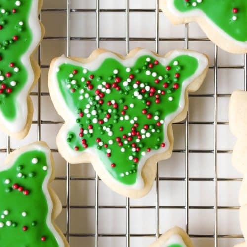tree-shaped sugar cookies on a cooling rack