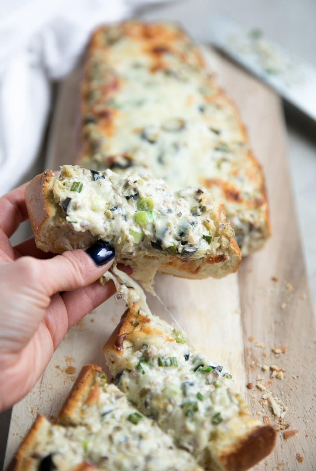 Cheesy Olive Tapenade Stuffed French Bread