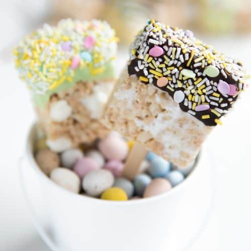 A close up of a chocolate-dipped Easter rice Krispie treat squares