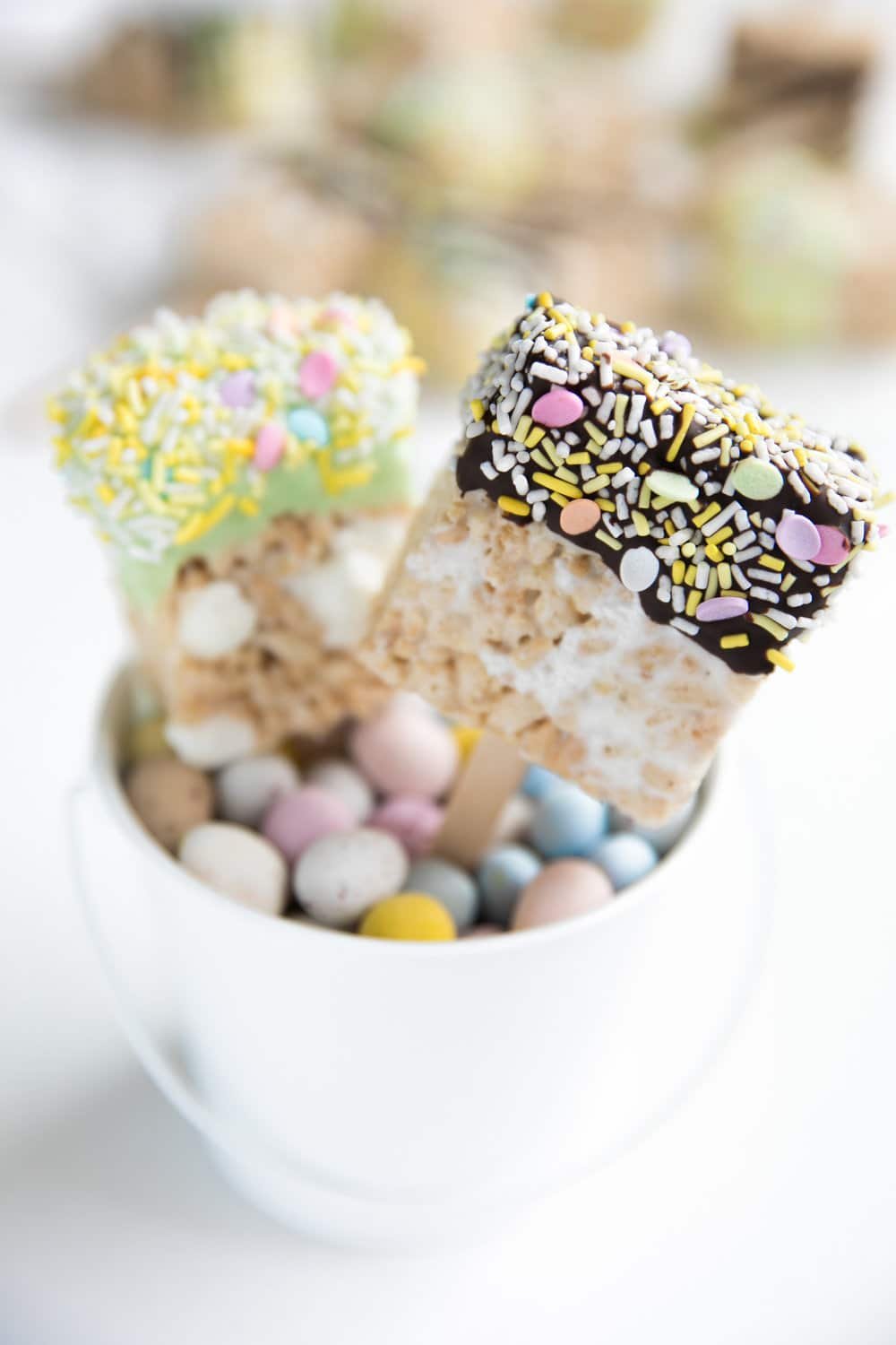 A close up of a chocolate-dipped Easter rice Krispie treat squares