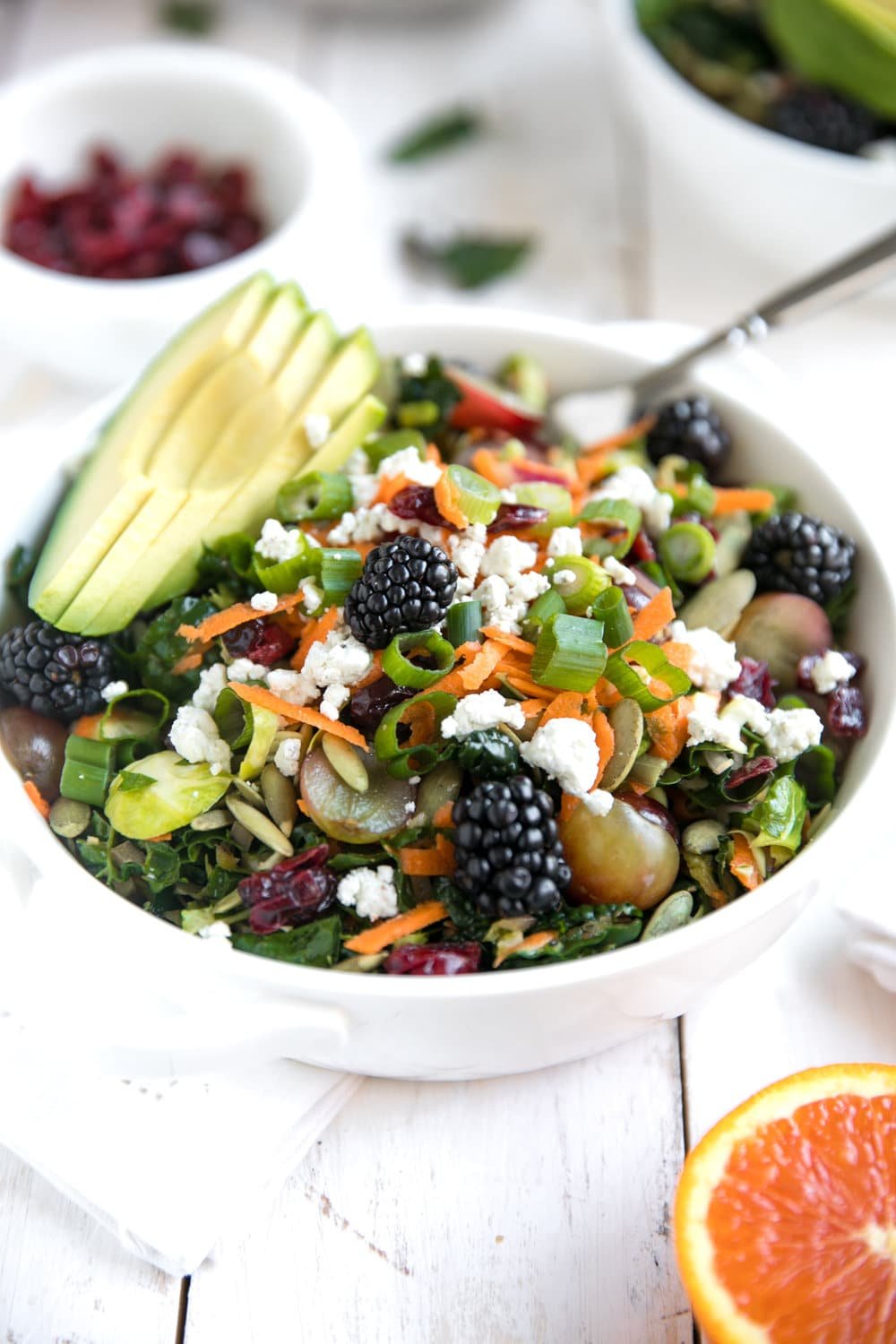 Kale and Brussels Sprouts Salad in a white bowl