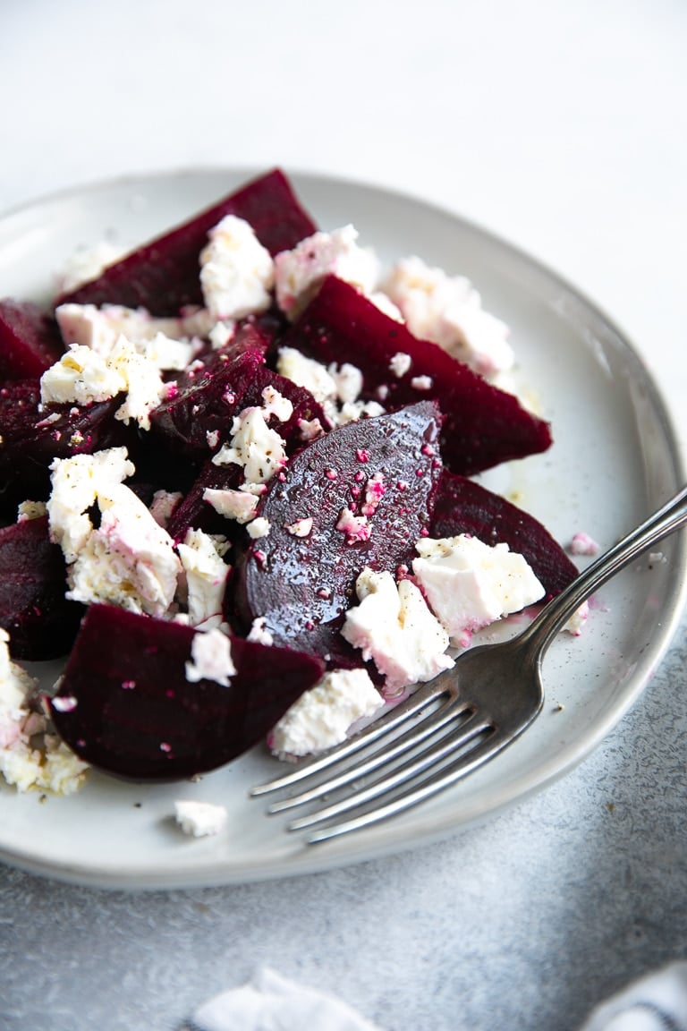 Beet and feta salad on a small grey salad plate.