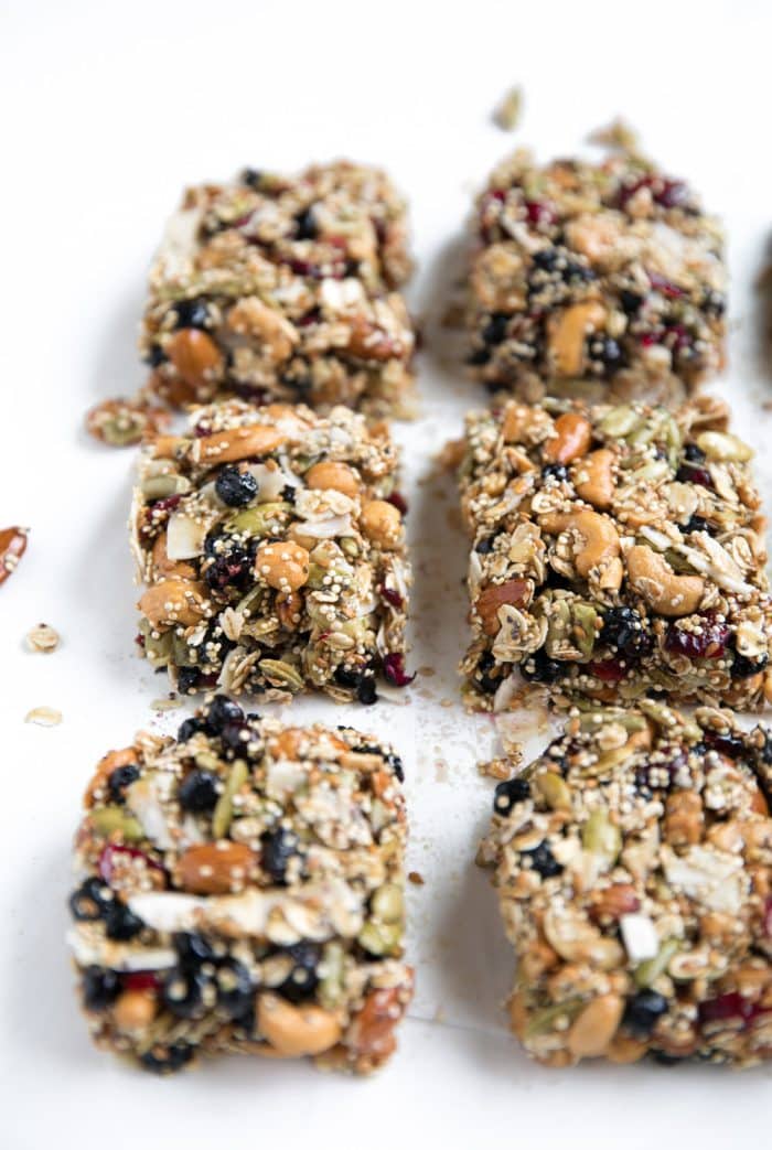 6 nut bars cut on parchment paper