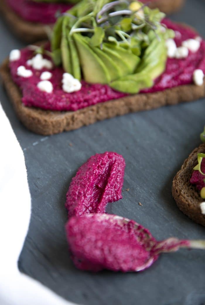 Avocado Toast with Beet Hummus on a spoon