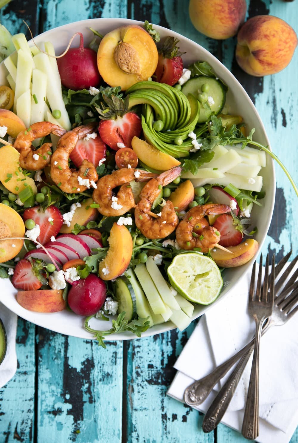 Summer Salad with sweet peaches, kohlrabi, strawberries, and spicy chipotle shrimp