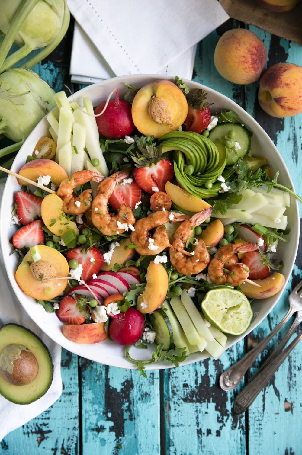 Shrimp Summer Salad in a large white bowl on a blue table