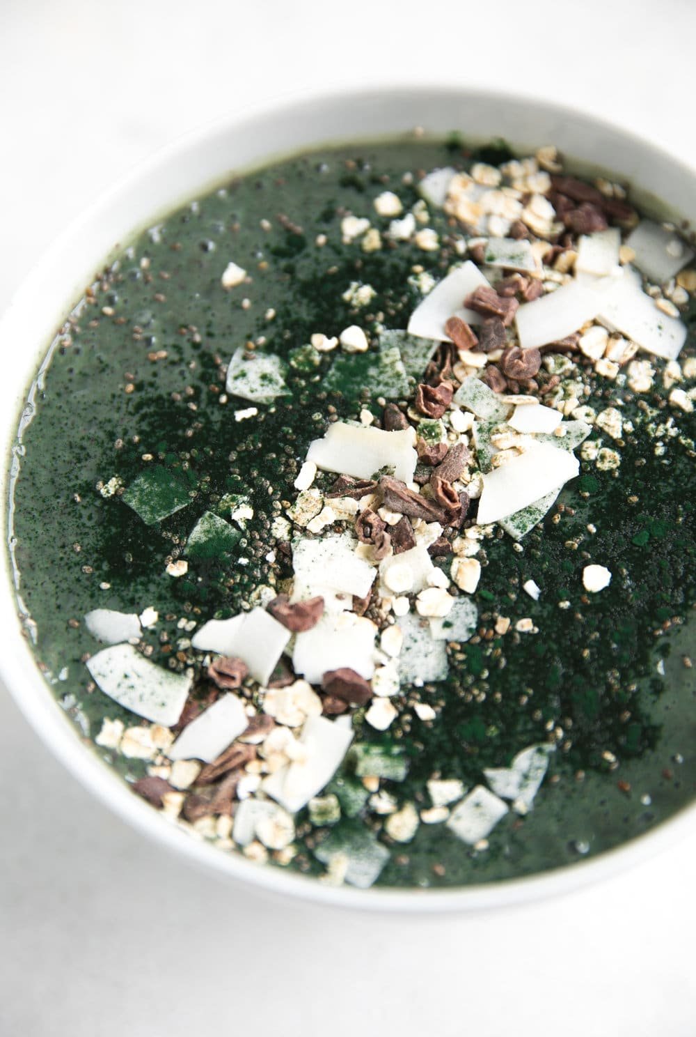 A close up of a bowl, with Smoothie and Spirulina