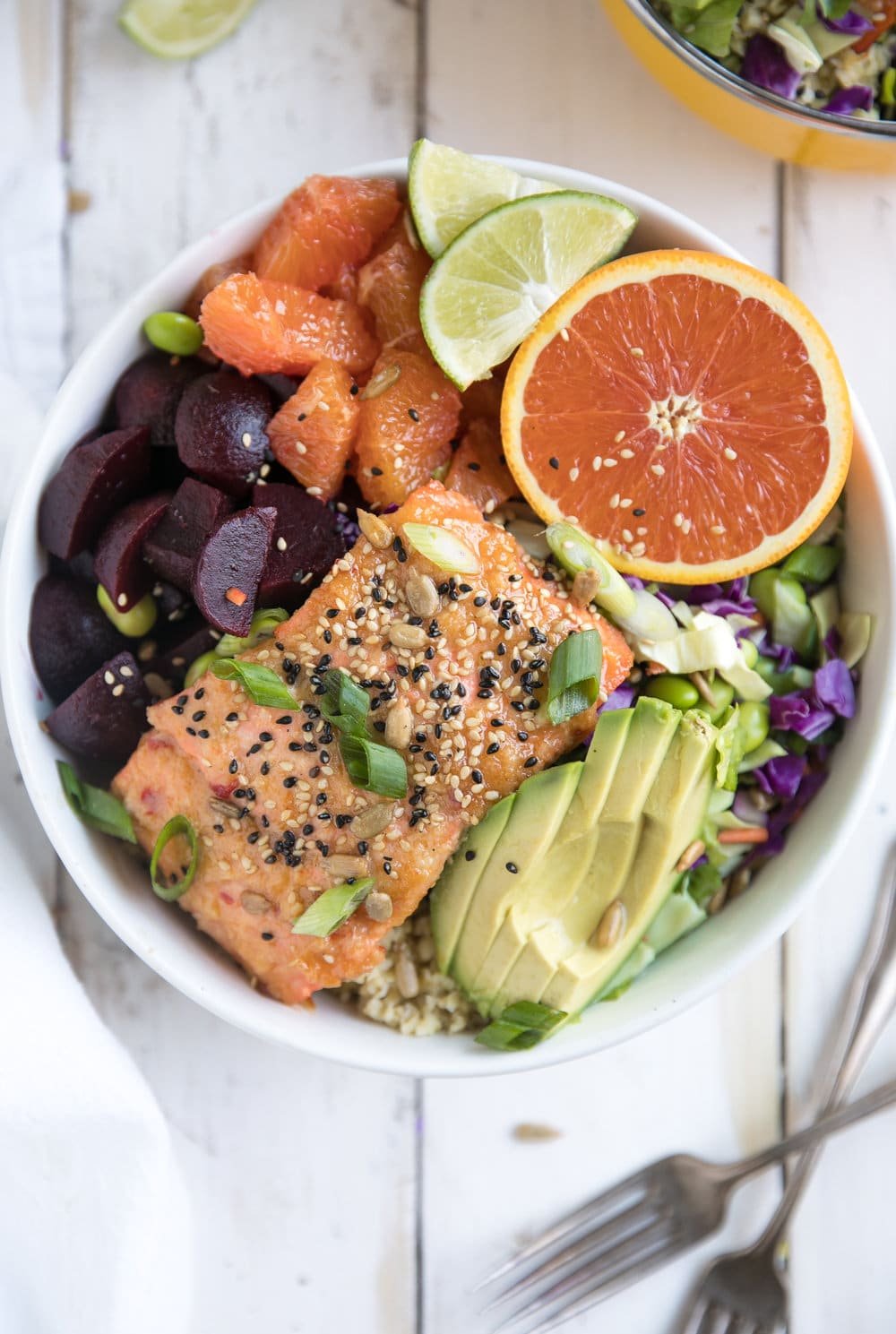 Super healthy foods like freekeh, beets, oranges, and avocado are just part of what make this nutritious 30 minute Sweet Chili Miso Salmon Salad a dinner win any night of the week!