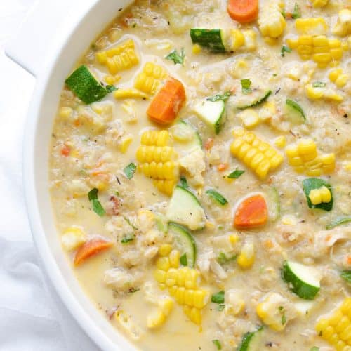 A bowl of soup, with corn zucchini Chowder