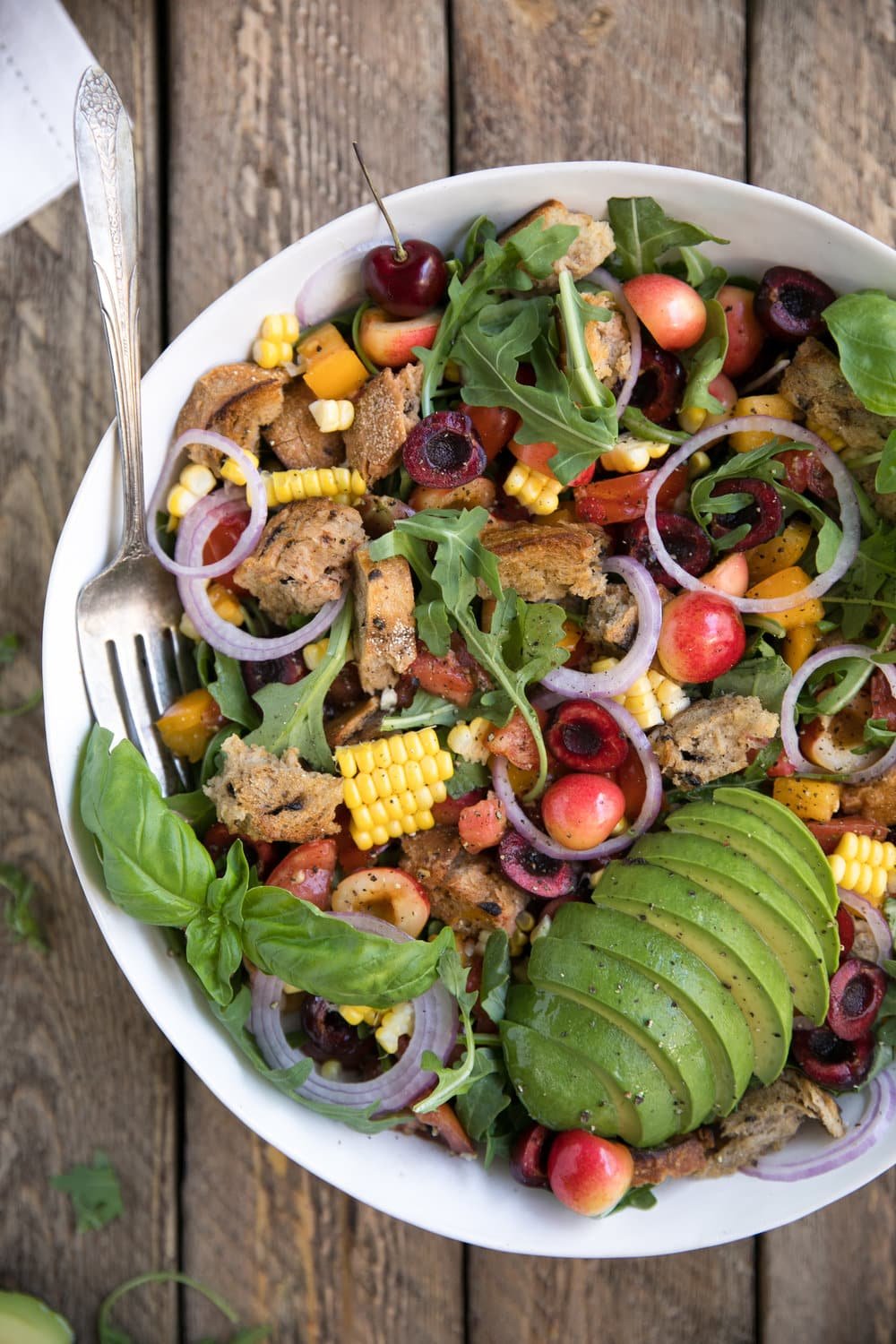 overhead photo of bowl of Cherry and Rocket Panzanella Salad