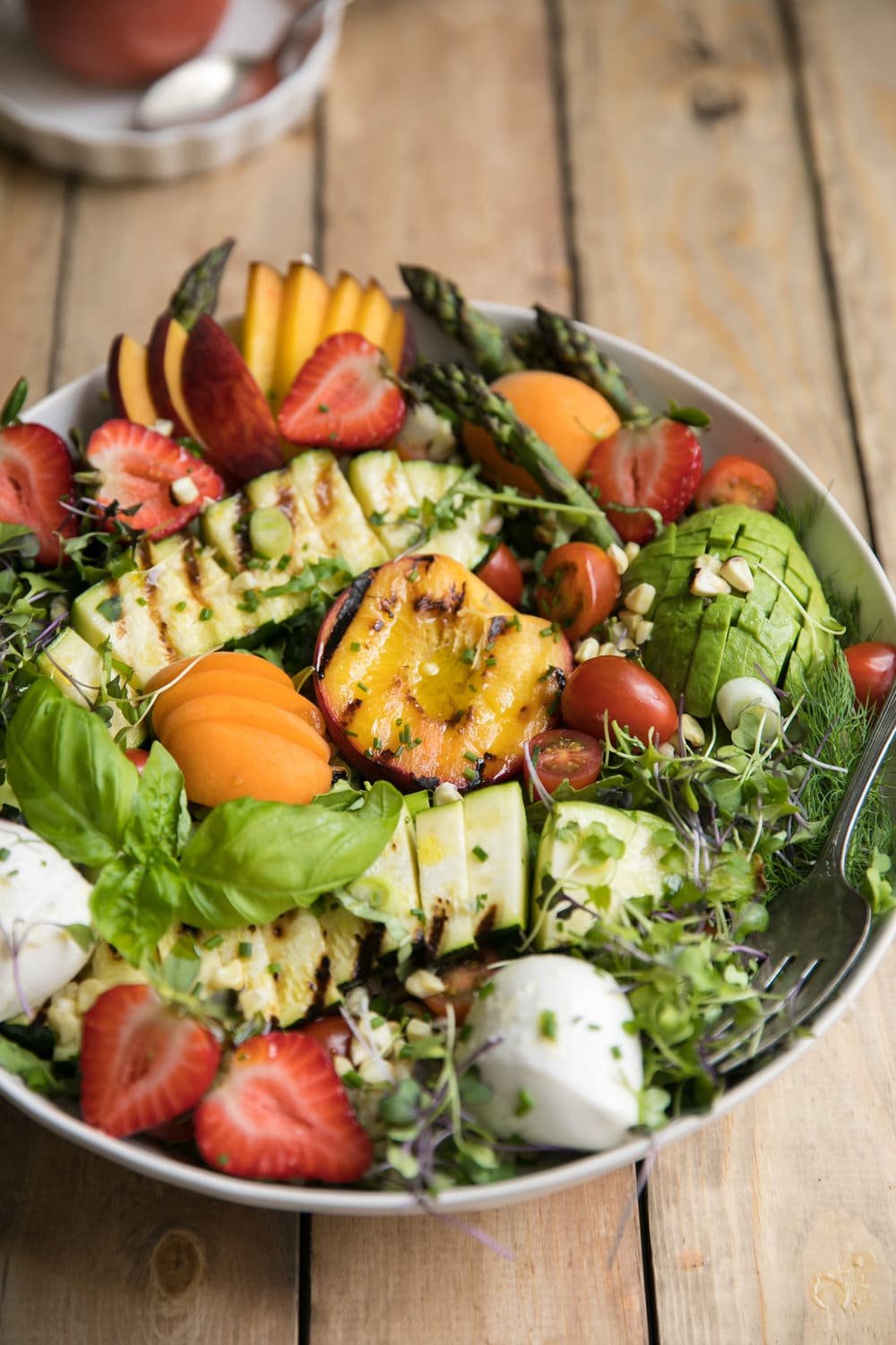 overhead photo of Grilled Peach, Corn, Zucchini and Asparagus Summer Salad with Strawberry Vinaigrette