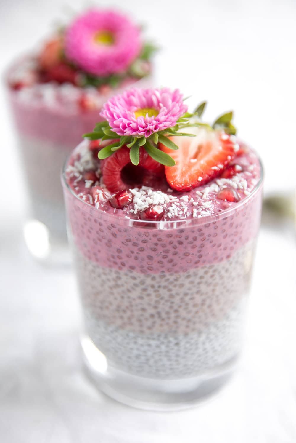 diagonal image of Triple Layer Chia Pudding Cup with flower on top