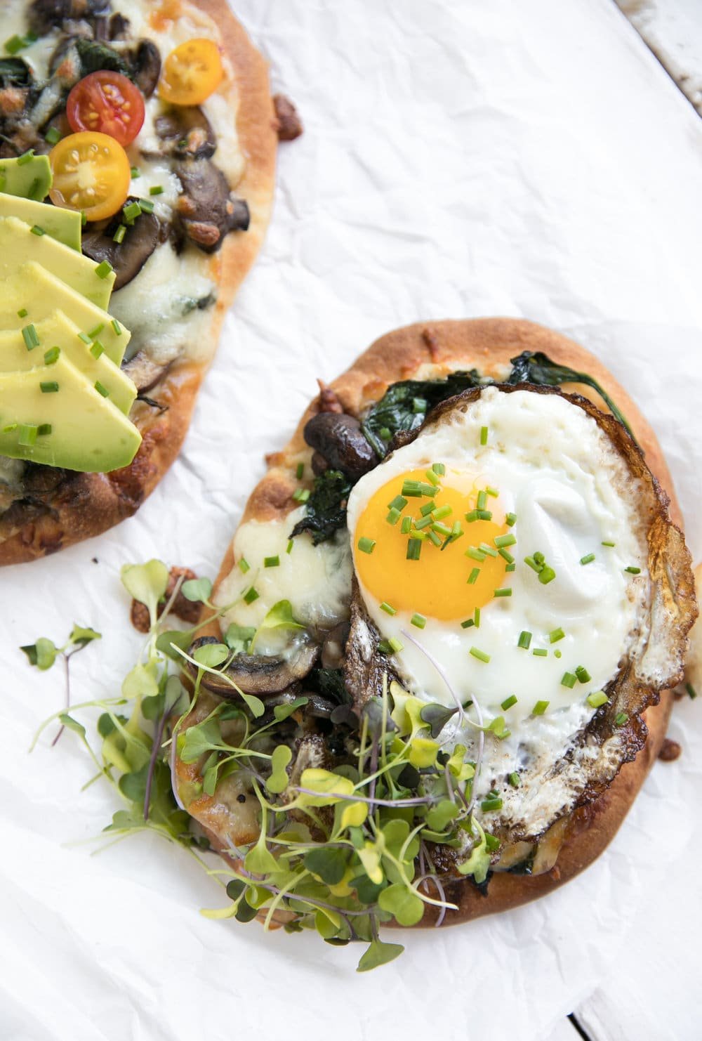 close up overhead photo of Breakfast Naan Pizza with Sauteéd Mushrooms and Shallots