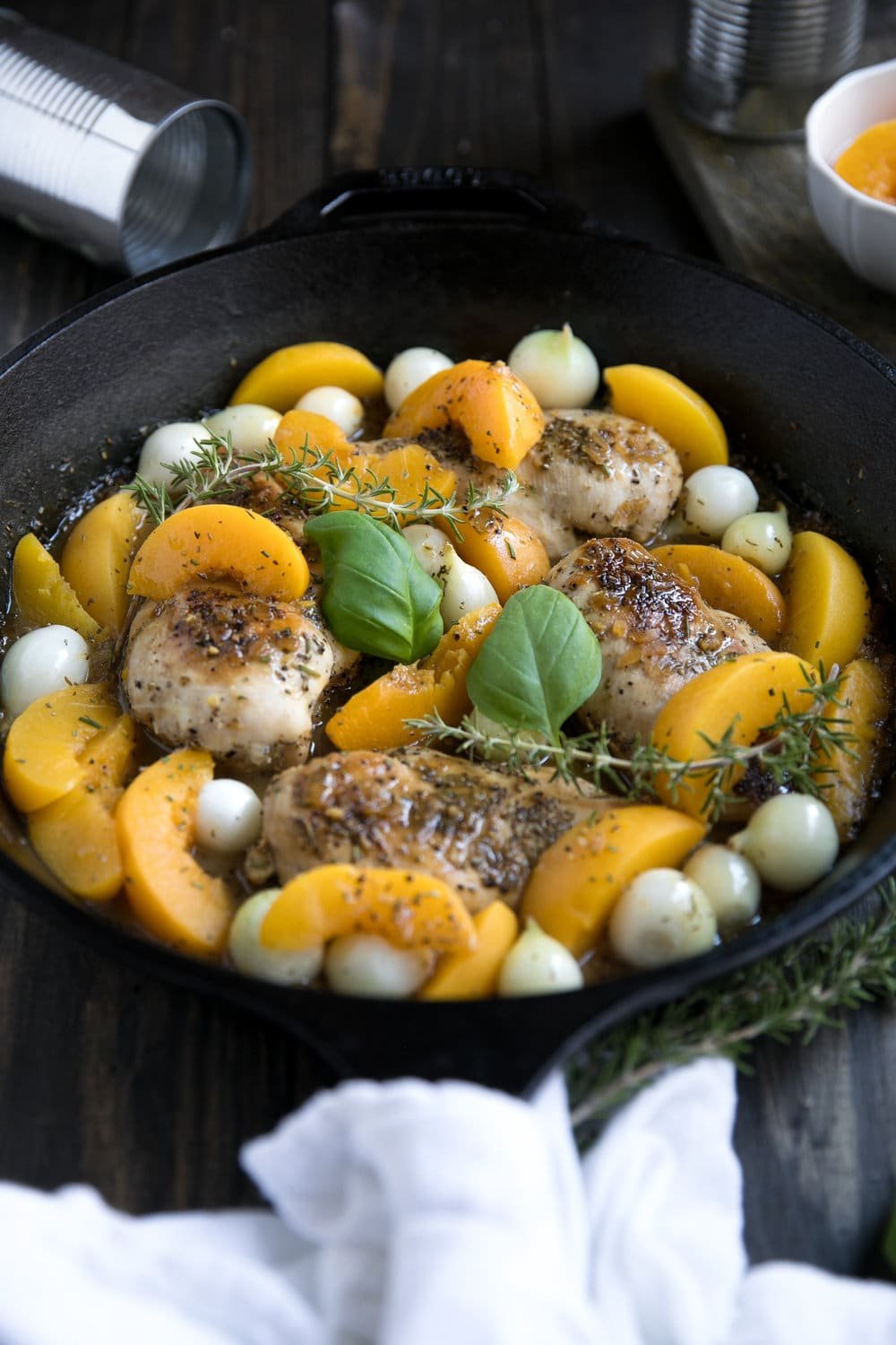 Fresh summer peaches may be on their way out, but that doesn't mean you can't enjoy them all year long in this easy, delicious and super healthy 30 Minute Peach and Chicken Skillet with Pearl Onions.