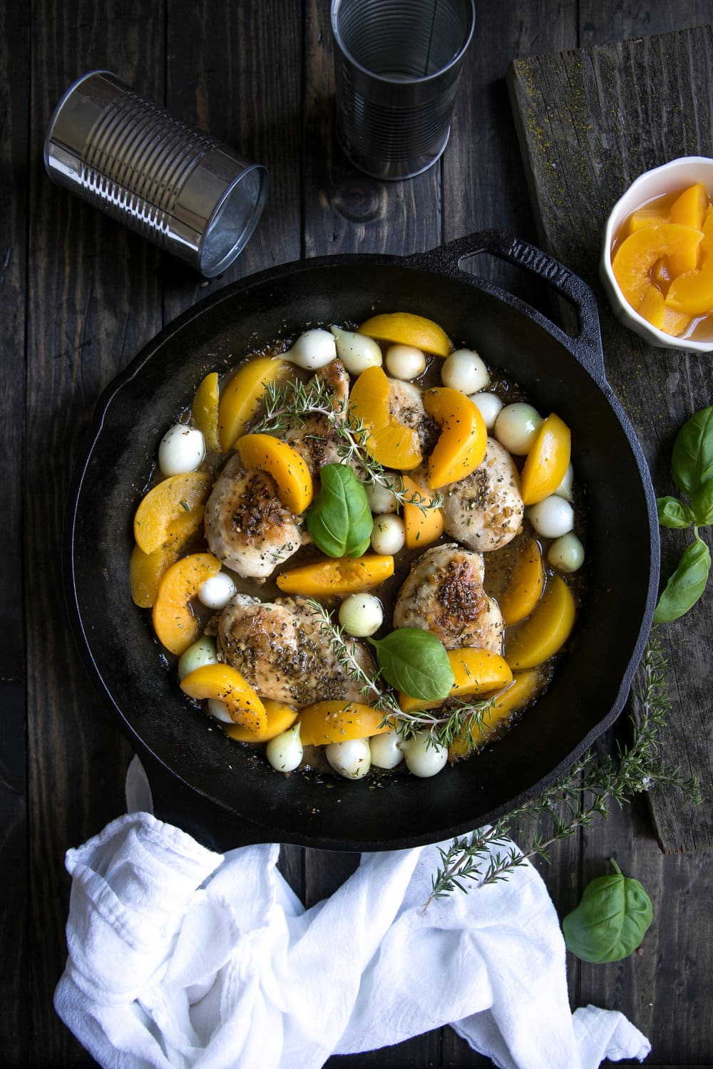 Fresh summer peaches may be on their way out, but that doesn't mean you can't enjoy them all year long in this easy, delicious and super healthy 30 Minute Peach and Chicken Skillet with Pearl Onions.