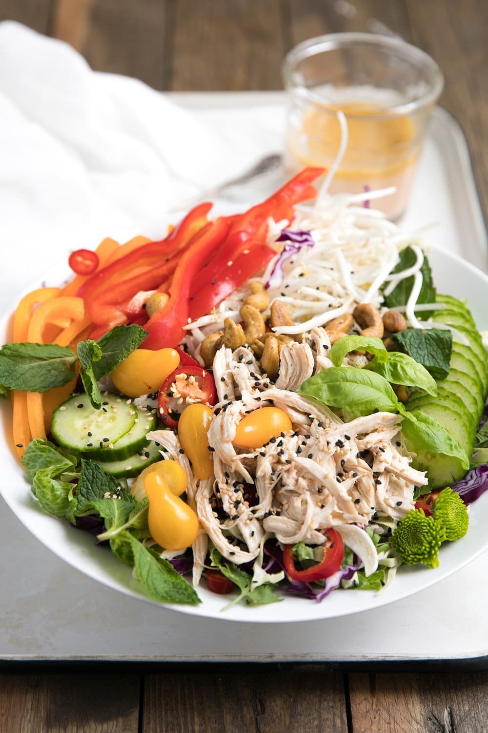Fresh, healthy and so easy to throw together, this Easy Asian Chopped Chicken Salad with homemade Sesame Ginger Vinaigrette makes a perfect lunch or dinner option.