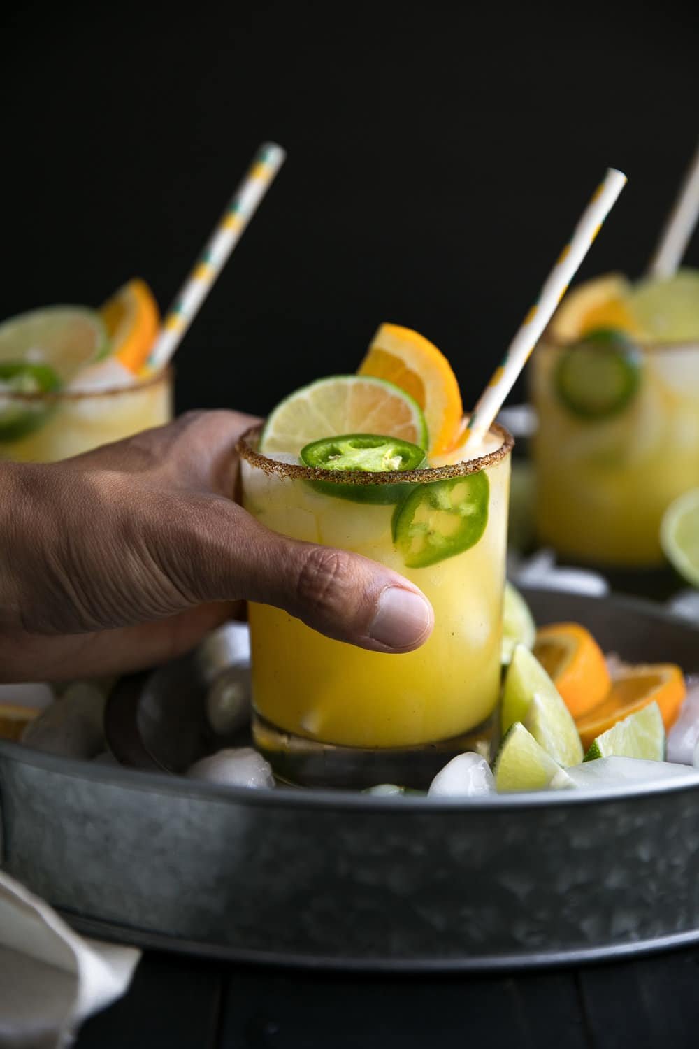 Perfect balance between salty, sweet and spicy, these Spicy Orange Margaritas with Agavero Orange Liqueur are guaranteed to be the life of any (21 years and older) party!