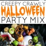 A festive black cauldron bowl filled with a colorful Halloween party snack mix. The mix includes green and purple candied popcorn, pretzels, almonds, chocolate candies, and spooky gummy candies shaped like worms, eyeballs, and vampire teeth, perfect for a Halloween celebration.