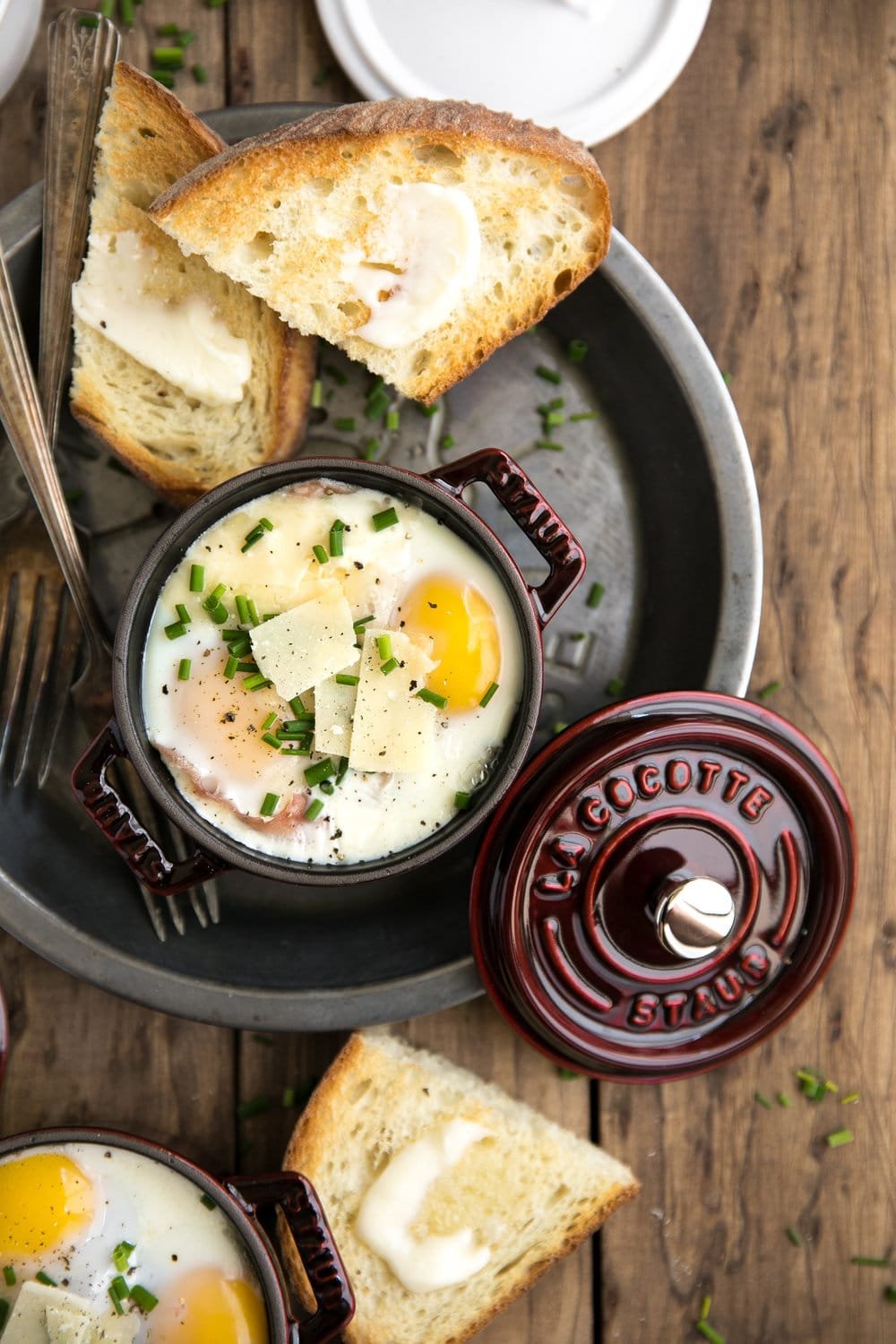 A egg in a coquette on a plate