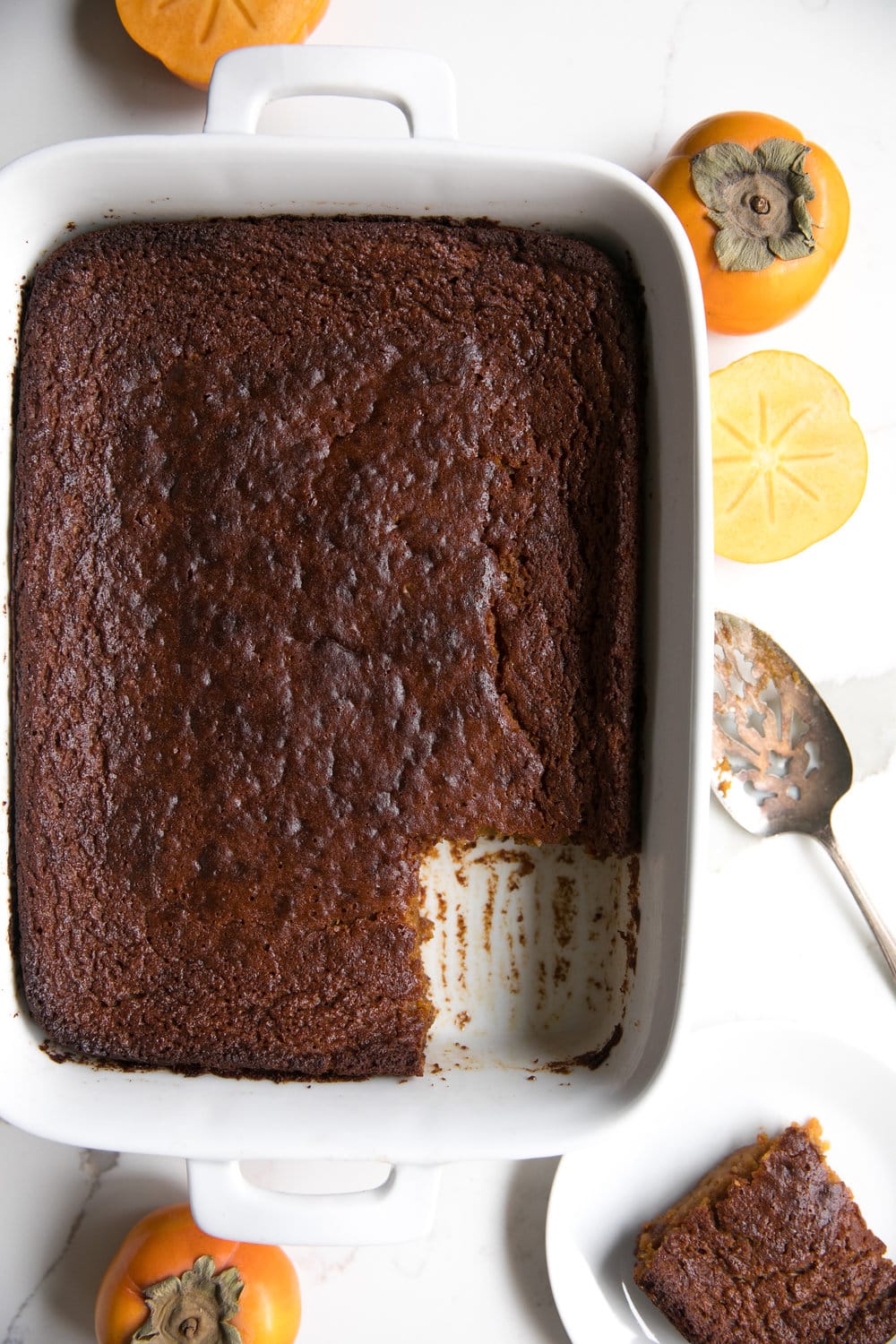 Fast and EASY Persimmon Pumpkin Pudding Cake. Basic and humble from the outside, but full of flavor, spice, pumpkin and persimmons on the inside..