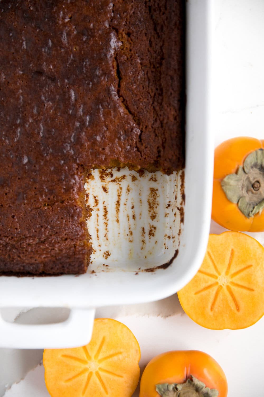 Fast and EASY Persimmon Pumpkin Pudding Cake. Basic and humble from the outside, but full of flavor, spice, pumpkin and persimmons on the inside..