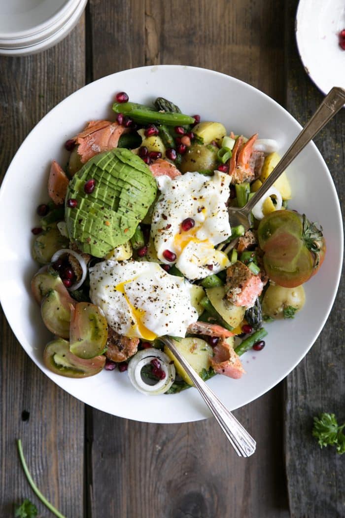 A plate of food on a table, with Asparagus avocado potato Salad