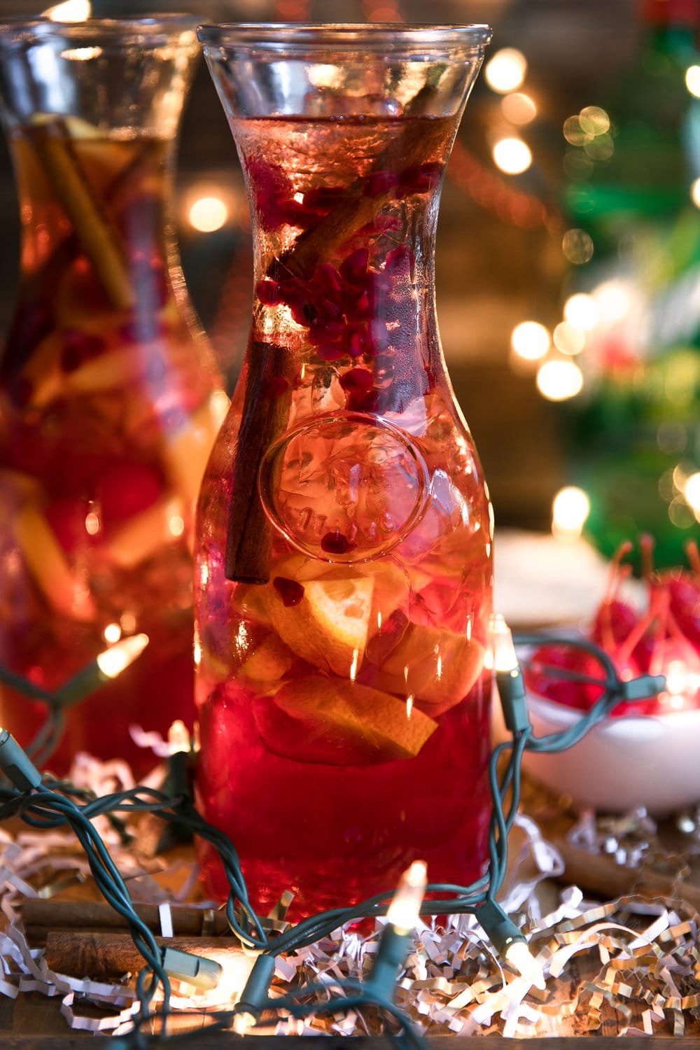 Cinnamon liqueur, bourbon, tart cherry juice, fresh orange wedges and sweet bubbly 7UP mix together to make this Orange and Cherry 7UP Spritzer; a delicious holiday cocktail