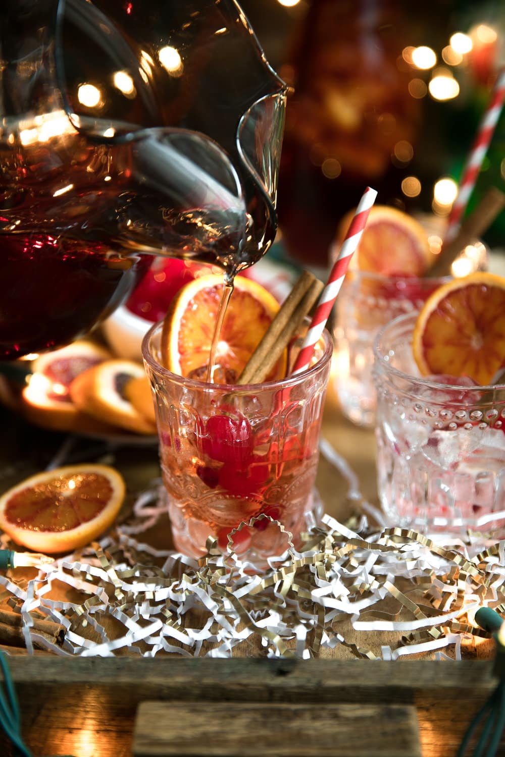 Cinnamon liqueur, bourbon, tart cherry juice, fresh orange wedges and sweet bubbly 7UP mix together to make this Orange and Cherry 7UP Spritzer; a delicious holiday cocktail