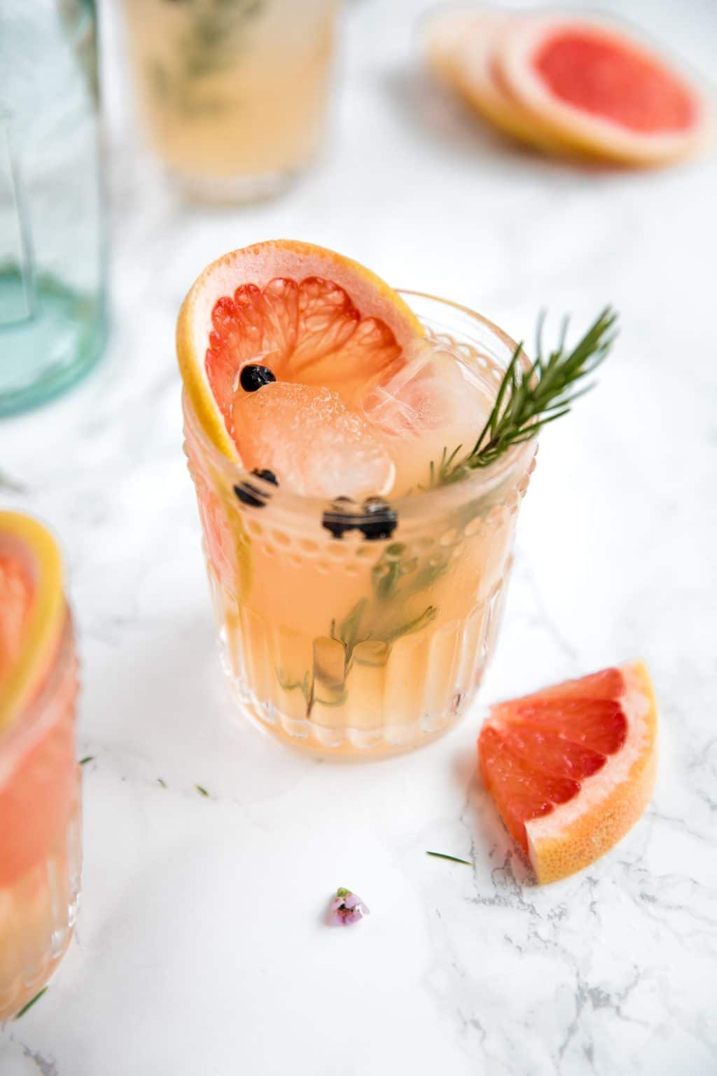 Sweet pink grapefruit juice, fragrant rosemary, and Elderflower Liqueur are added to gin and tonic to make a fresh, refreshing, and fun Elderflower Grapefruit Gin and Ton