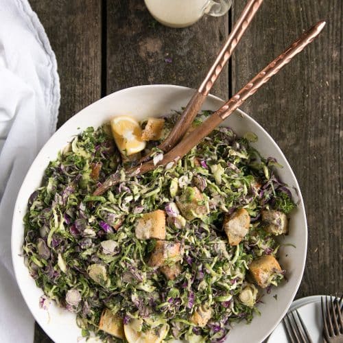 Shredded Brussels Sprouts Caesar Salad with Homemade Croutons