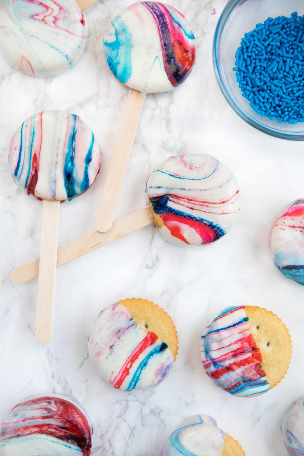 Creamy Peanut Butter Sandwiched between Buttery RITZ Cracker and dipped in swirled Red, White, and Blue melted white Chocolate