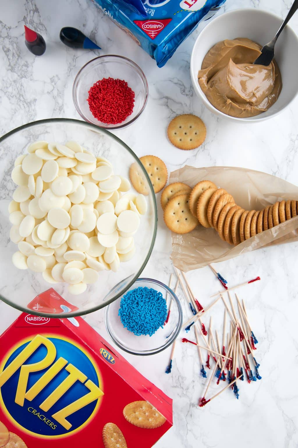 Creamy Peanut Butter Sandwiched between Buttery RITZ Cracker and dipped in swirled Red, White, and Blue melted white Chocolate