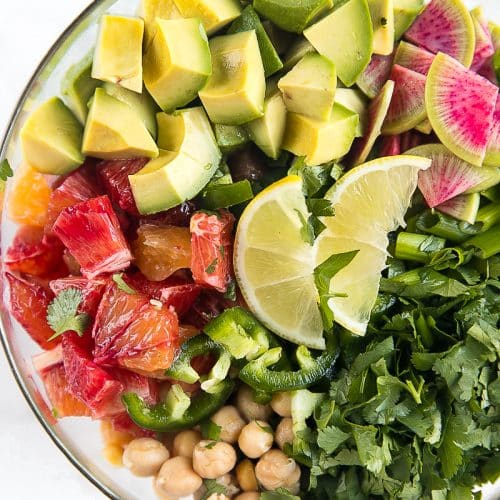Fresh, healthy, and completely vegetarian, this Avocado Citrus Chickpea Salad is loaded with sweet blood oranges, creamy avocados, spicy green onion, spicy jalapeño, and cilantro. Summertime dinner magic that takes little more than 10 minutes to throw together.