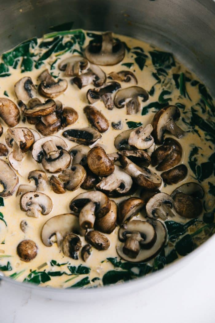 Sauteed mushrooms and spinach in a cream sauce.