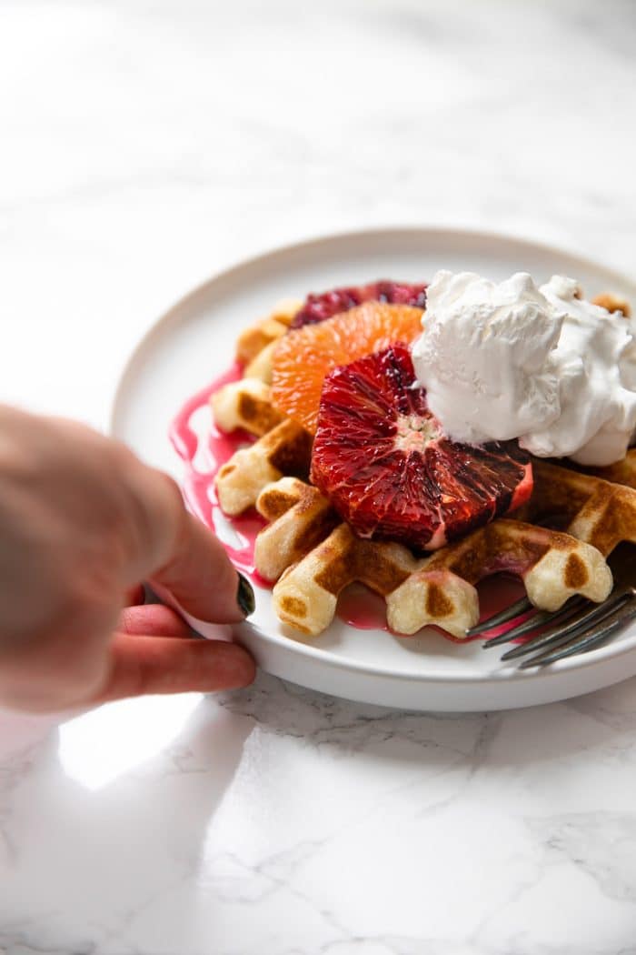 Light, fluffy and perfectly crisp around the edges, these Easy Crispy Waffles with Blood Orange Glaze are delicious for breakfast, brunch, dinner, or even dessert!