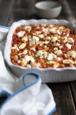 Fiber-filled white beans, sweet tomatoes, and tangy feta make this Tomato Baked Vegetarian Beans with Tangy Feta an easy and healthy anytime dinner loved by the whole family. Serve with homemade parsley pesto and fresh, crusty bread for an unforgettable Meatless Monday dish.