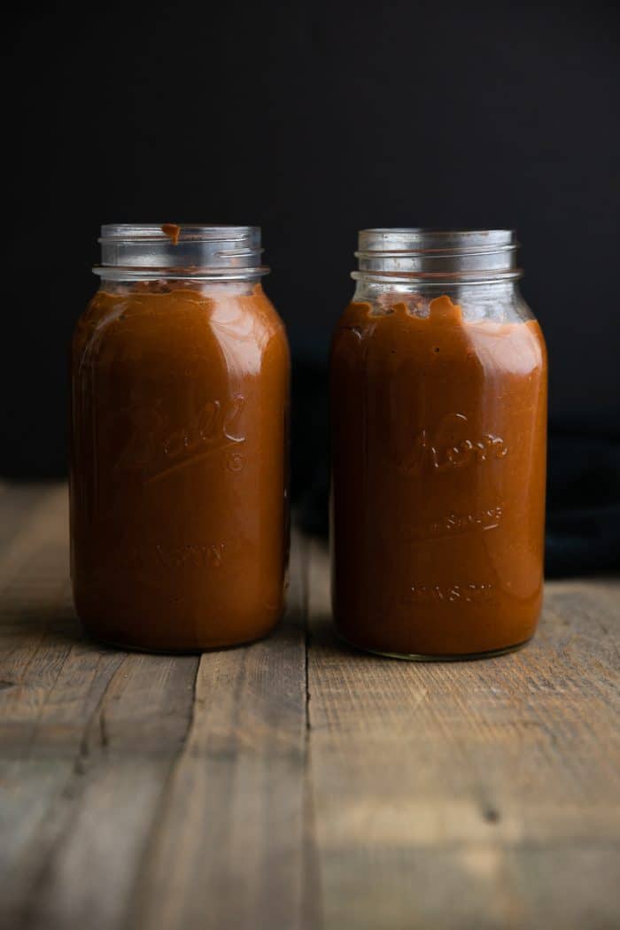 Jars of leftover mole sauce ready for storing.