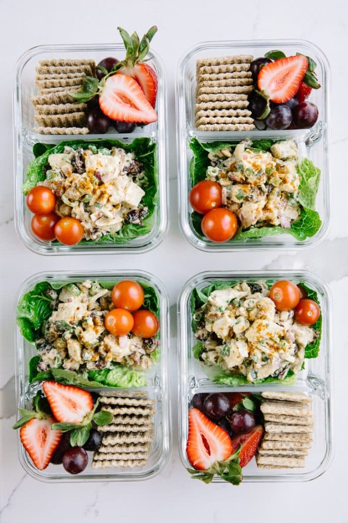 Meal prep snack trays with chicken salad and crackers