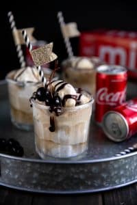 Backyard campout complete with Coca-Cola Ice Cream Floats made with crisp, cold and refreshing Coca-Cola, creamy vanilla ice cream, and smooth chocolate syrup.