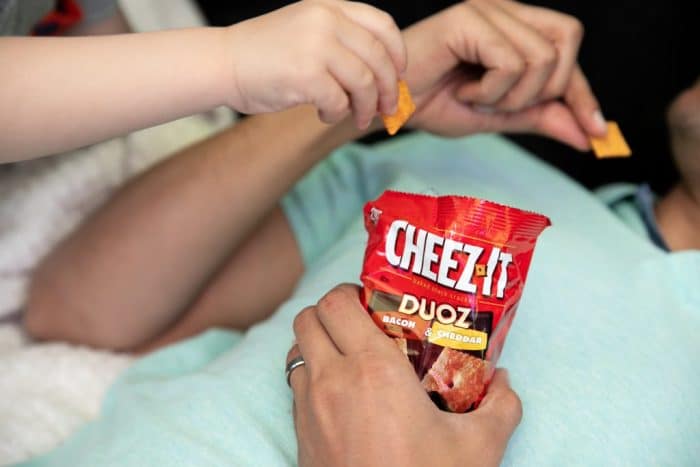 man eating Cheez-It Duoz