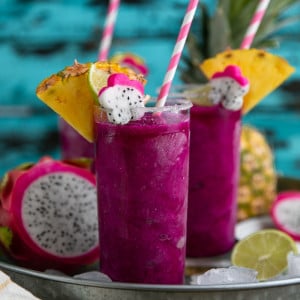 Cold, crisp, and refreshing, these Frozen Pineapple Dragon Fruit Margaritas are the perfect solution for all those hot summer days and backyard BBQs. Swap the tequila for pineapple juice to make a healthy, fruit packed smoothie loved by both kids and adults!