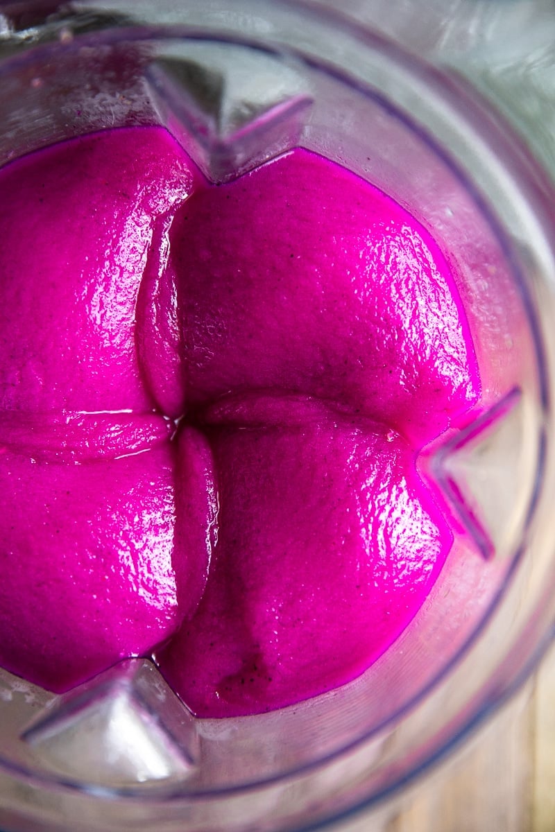 Frozen Pineapple Dragon Fruit Margaritas. Cold, crisp, and refreshing, these Frozen Pineapple Dragon Fruit Margaritas are the perfect solution for all those hot summer days and backyard BBQs. Swap the tequila for pineapple juice to make a healthy, fruit packed smoothie loved by both kids and adults! via @theforkedspoon #margarita #tequila #cocktail #frozenmargarita #drinkrecipe #dragonfruit | https://theforkedspoon.com/ dragon fruit margarita in the blender