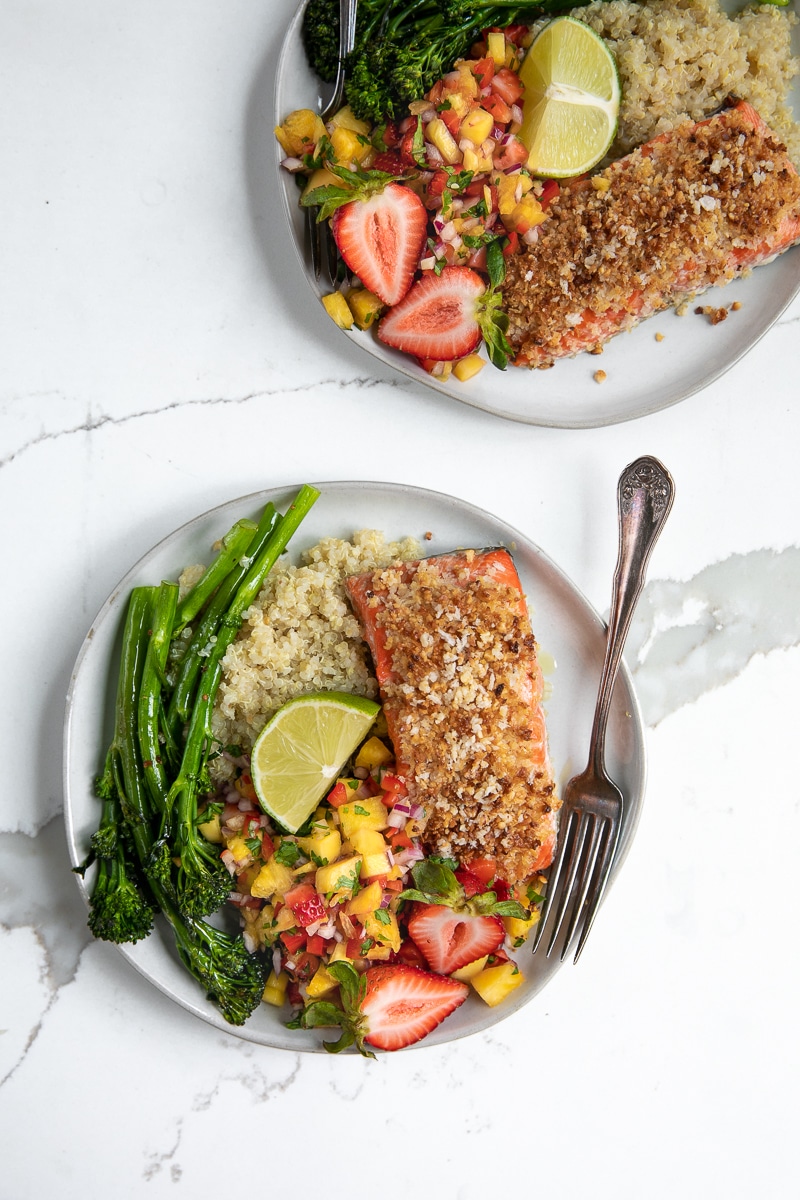 Fresh fruit salsa, quinoa, and roasted broccolini pair up with Omega-rich salmon in this crazy easy and super healthy Macadamia Crusted Salmon with Pineapple Mango Salsa.
