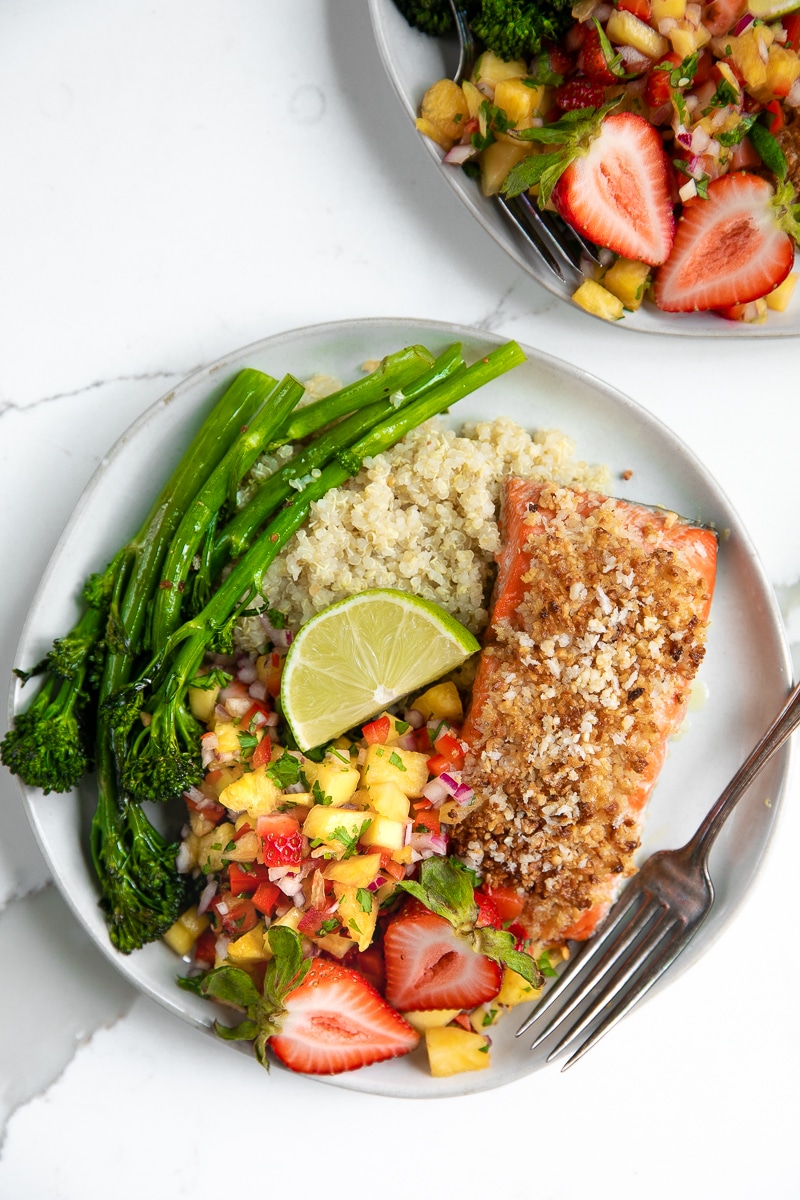 Fresh fruit salsa, quinoa, and roasted broccolini pair up with Omega-rich salmon in this crazy easy and super healthy Macadamia Crusted Salmon with Pineapple Mango Salsa.