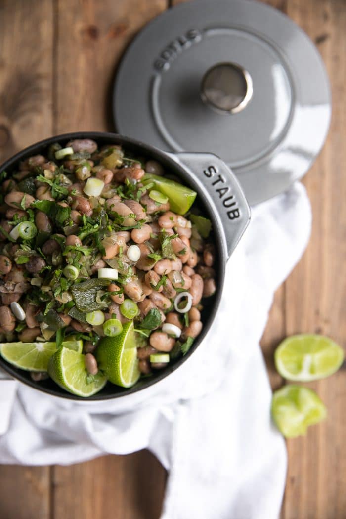 A fun and flavorful twist on boring bland beans, these easy Drunken Beans with Poblanos taste fantastic eaten alone or paired with all your favorite Mexican dishes.