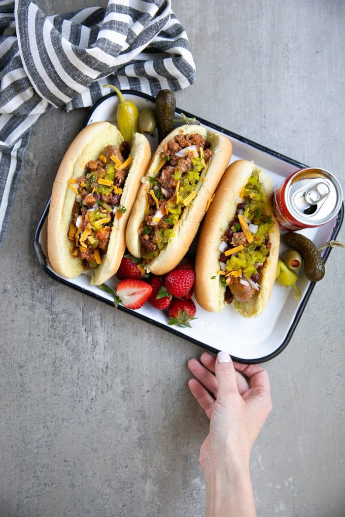 Easy Instant Pot Coca-Cola Chili and Sausage Dogs. Hearty beef chili cooked in the Instant Pot under 30 minutes. Serve at your next bbq alongside a full sausage dog bar!