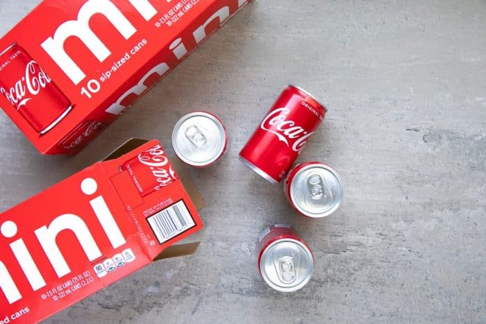 Coke cans on table